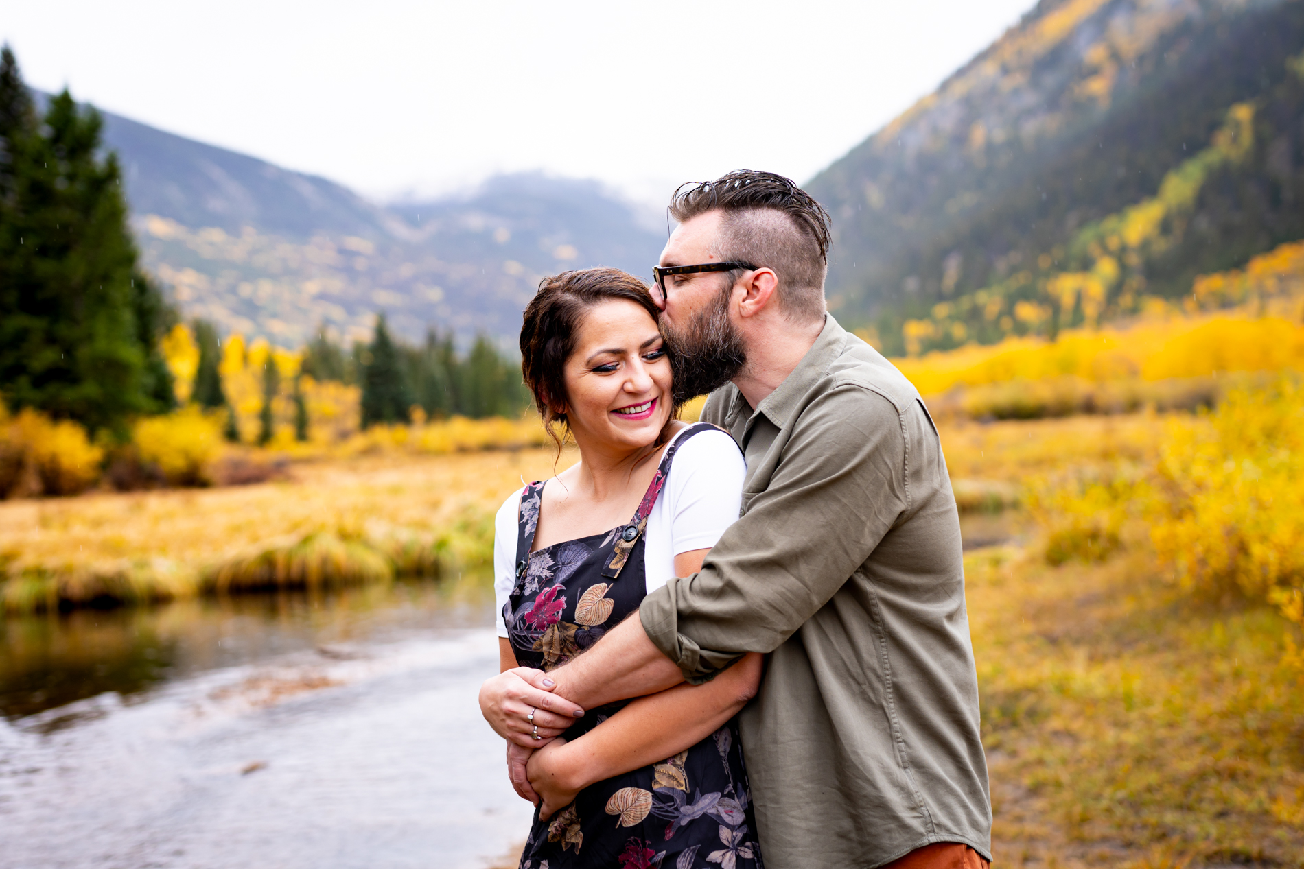 Cottonwood Pass Engagement Photos in Buena Vista with fall foliage, mountains and a winter blizzard