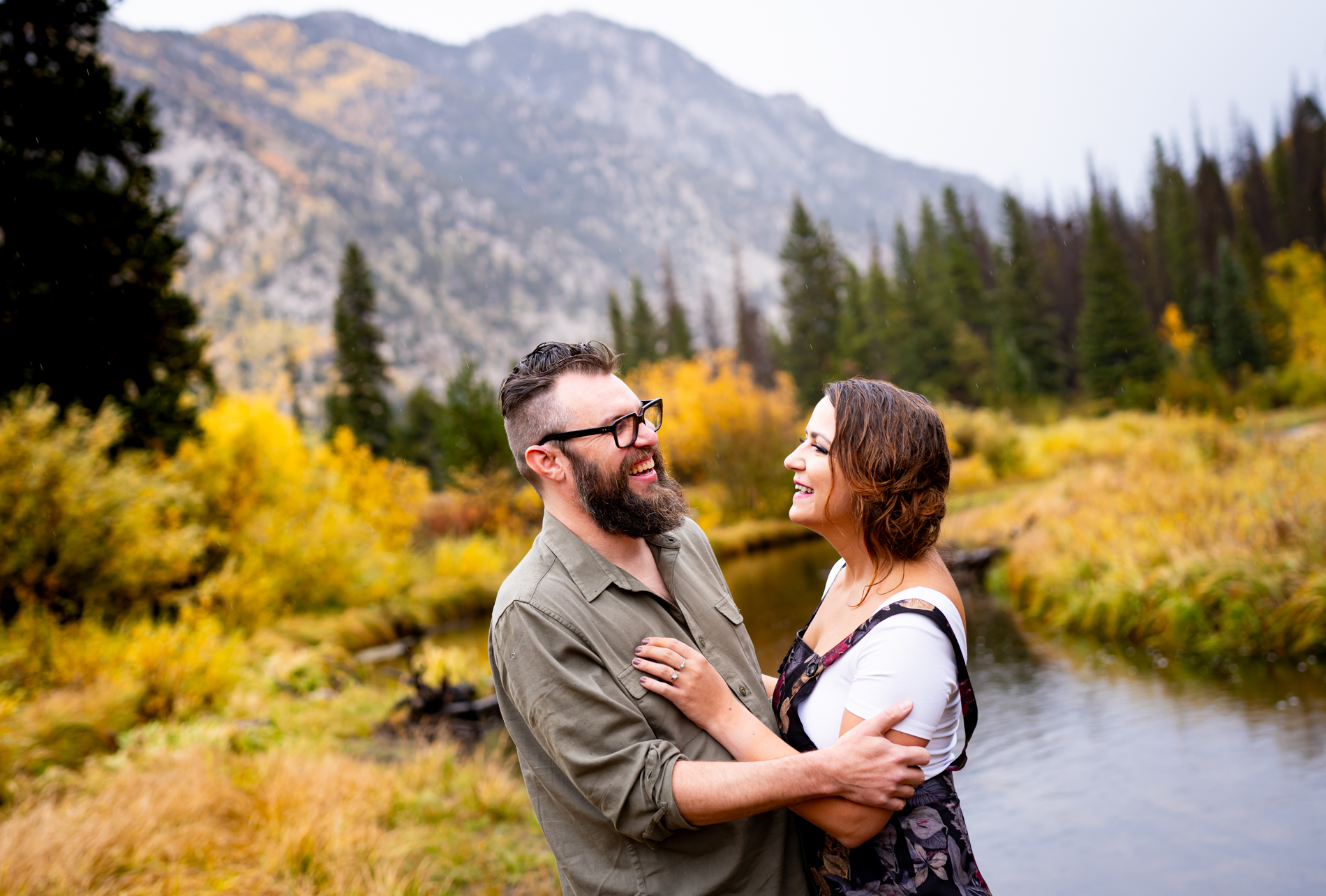 Cottonwood Pass Engagement Photos in Buena Vista with fall foliage, mountains and a winter blizzard