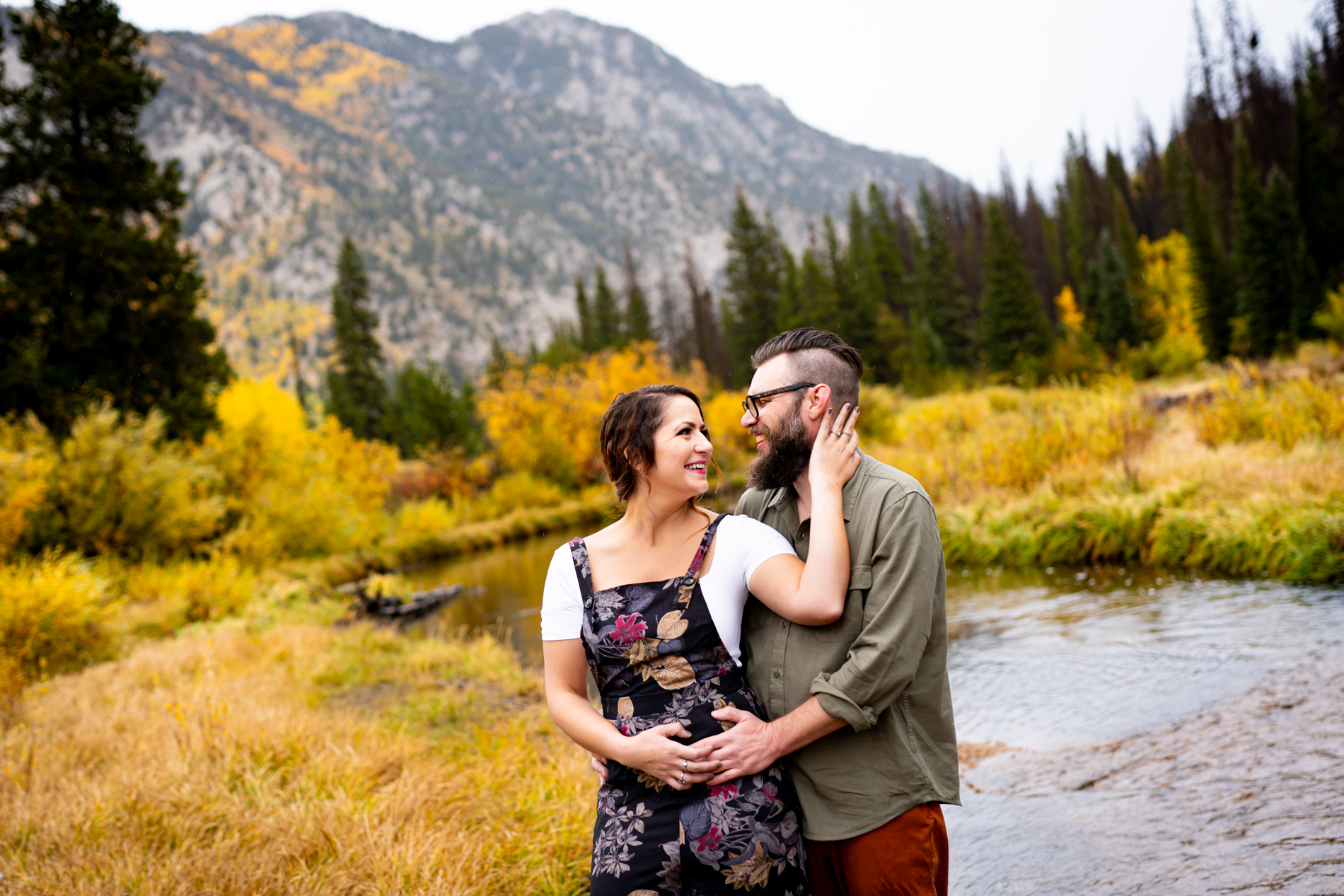 Cottonwood Pass Engagement Photos in Buena Vista with fall foliage, mountains and a winter blizzard