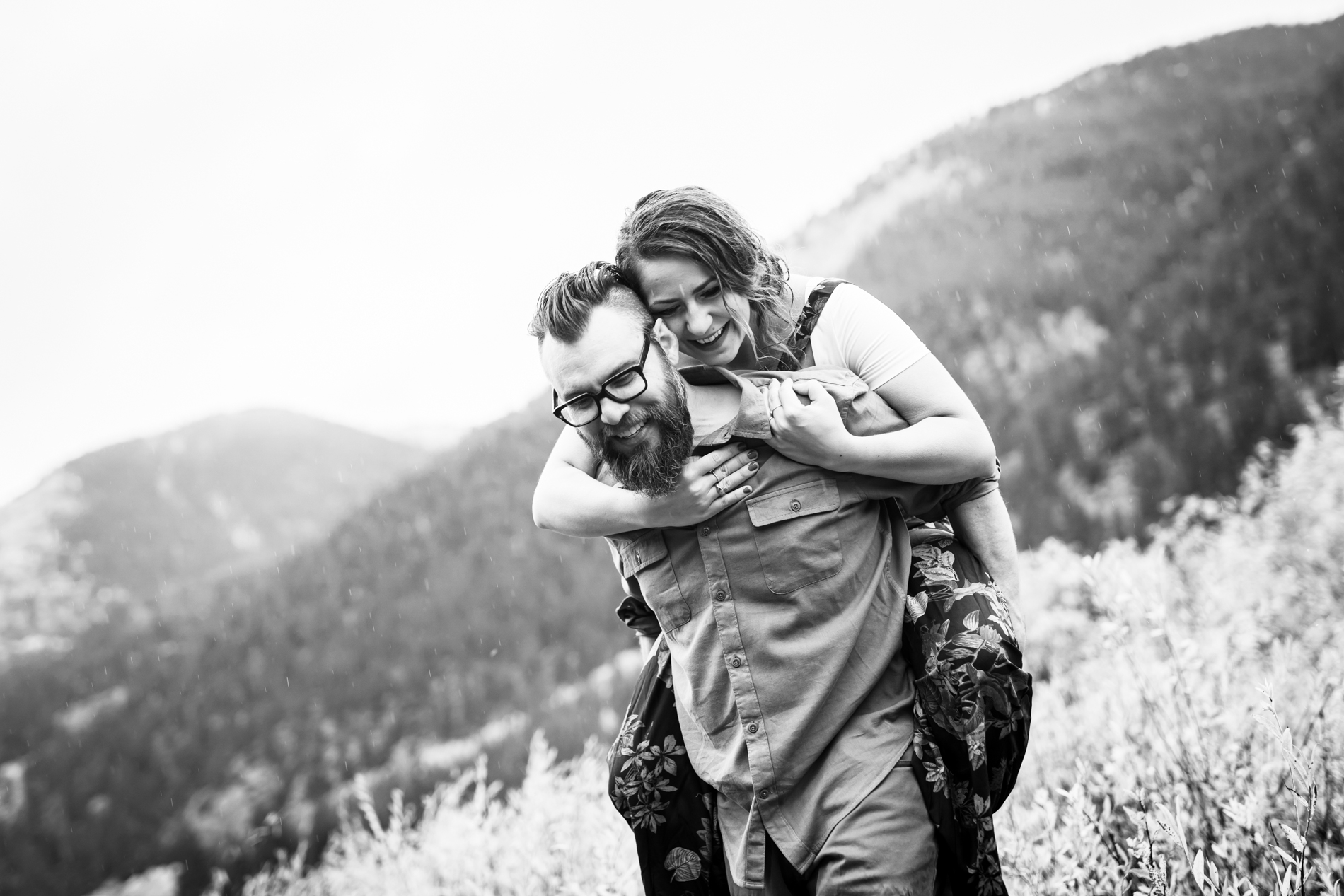 Cottonwood Pass Engagement Photos in Buena Vista with fall foliage, mountains and a winter blizzard