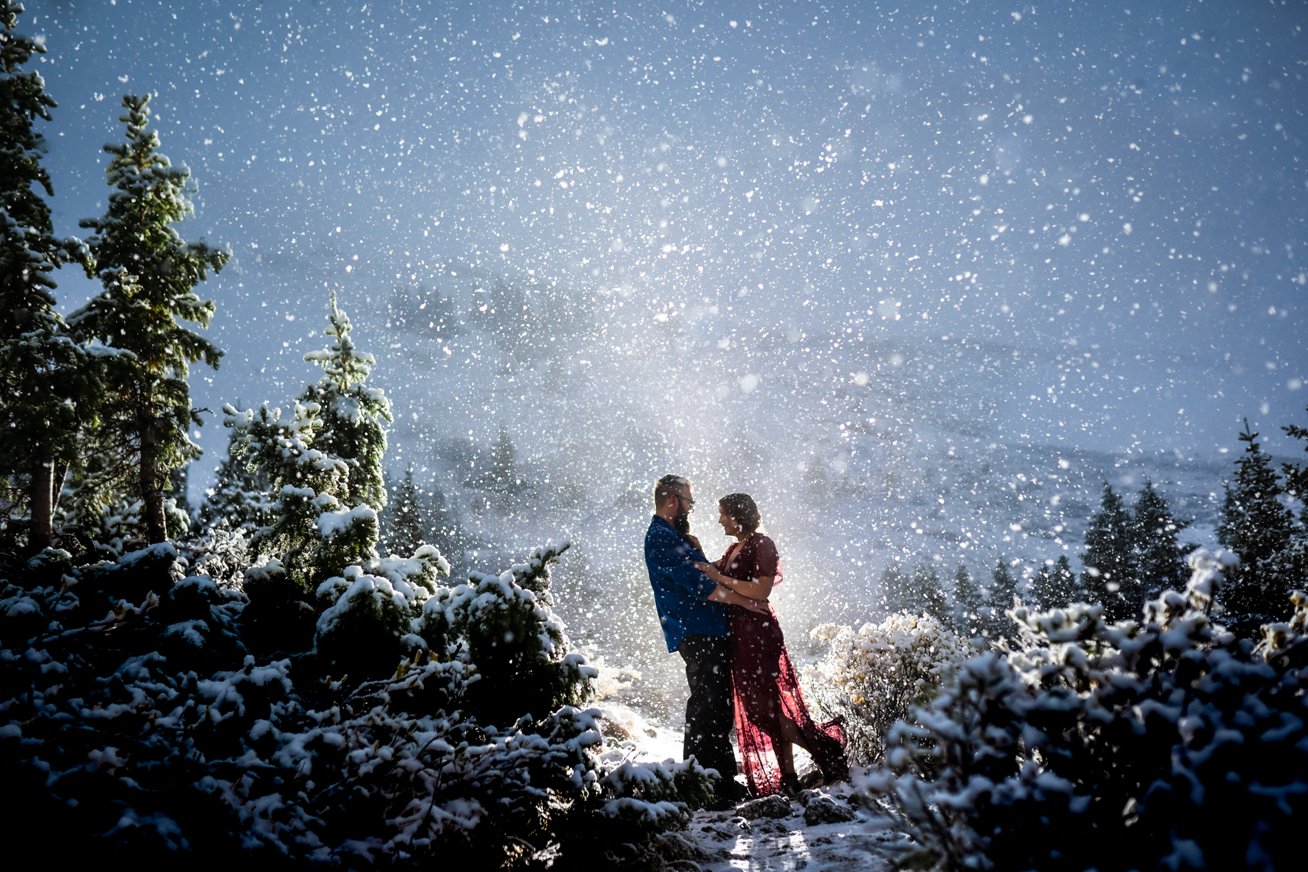 Cottonwood Pass Engagement Photos in Buena Vista with fall foliage, mountains and a winter blizzard