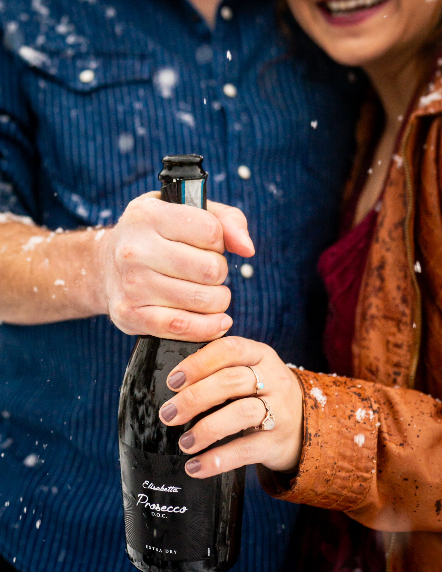 Cottonwood Pass Engagement Photos in Buena Vista with fall foliage, mountains and a winter blizzard