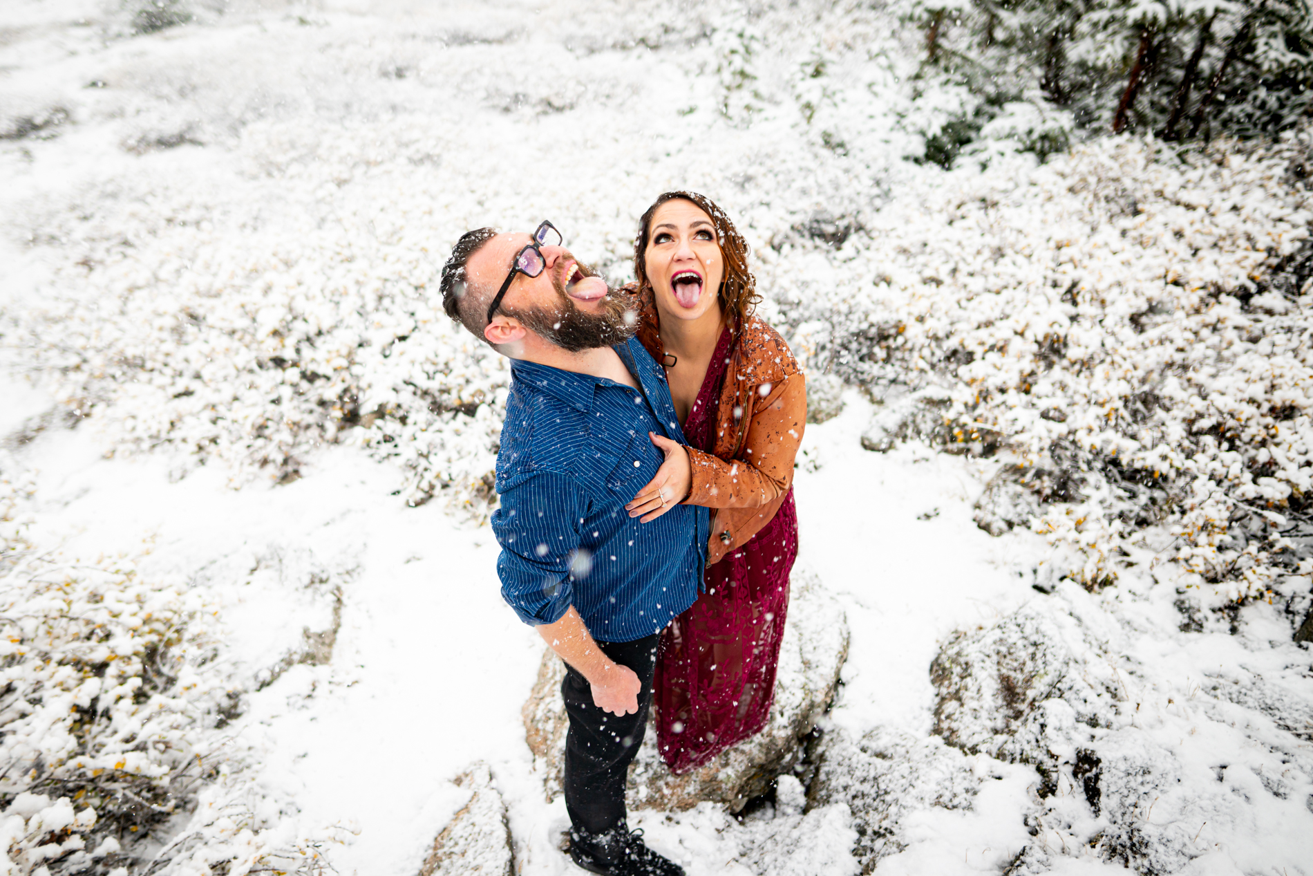 Cottonwood Pass Engagement Photos in Buena Vista with fall foliage, mountains and a winter blizzard