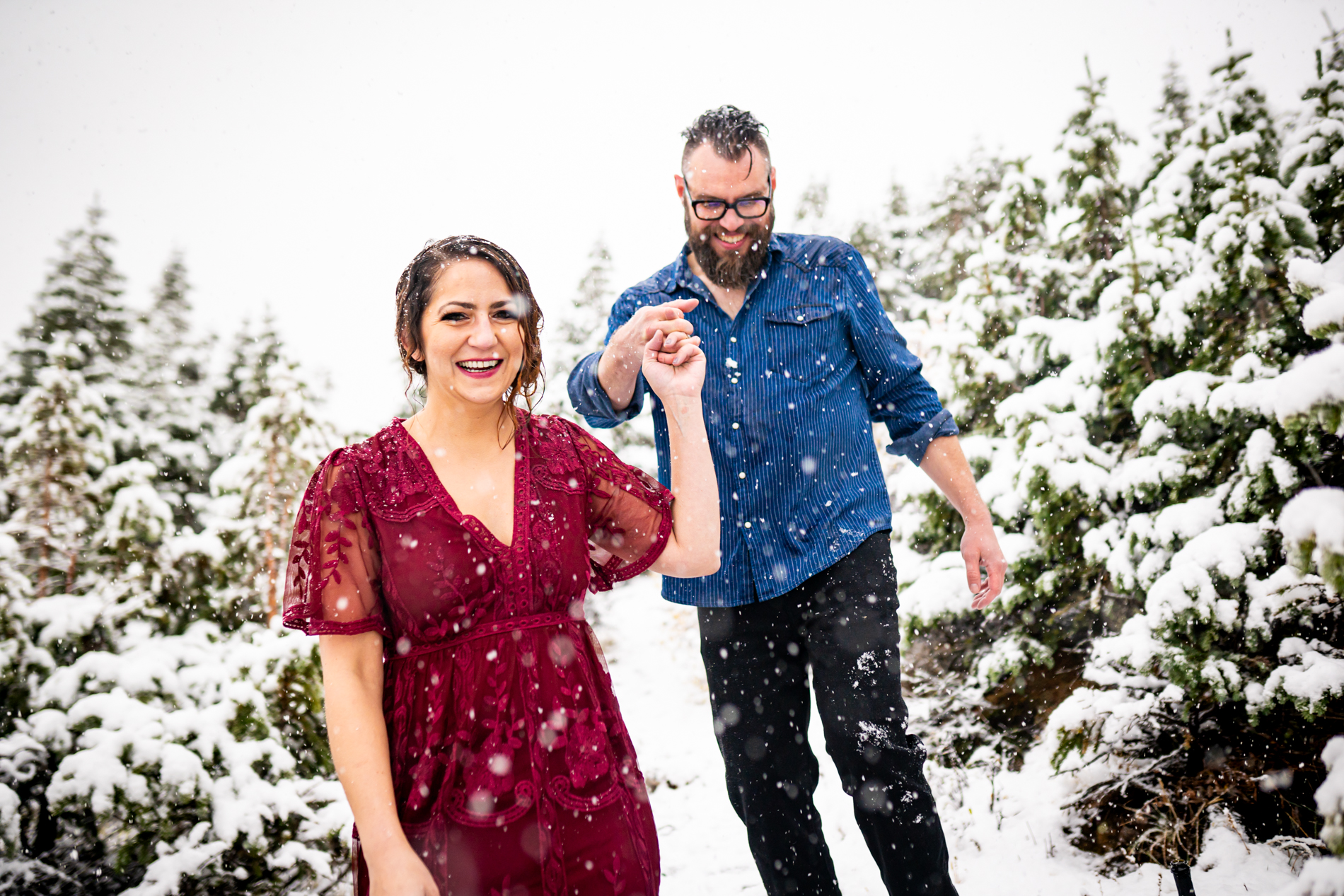 Cottonwood Pass Engagement Photos in Buena Vista with fall foliage, mountains and a winter blizzard