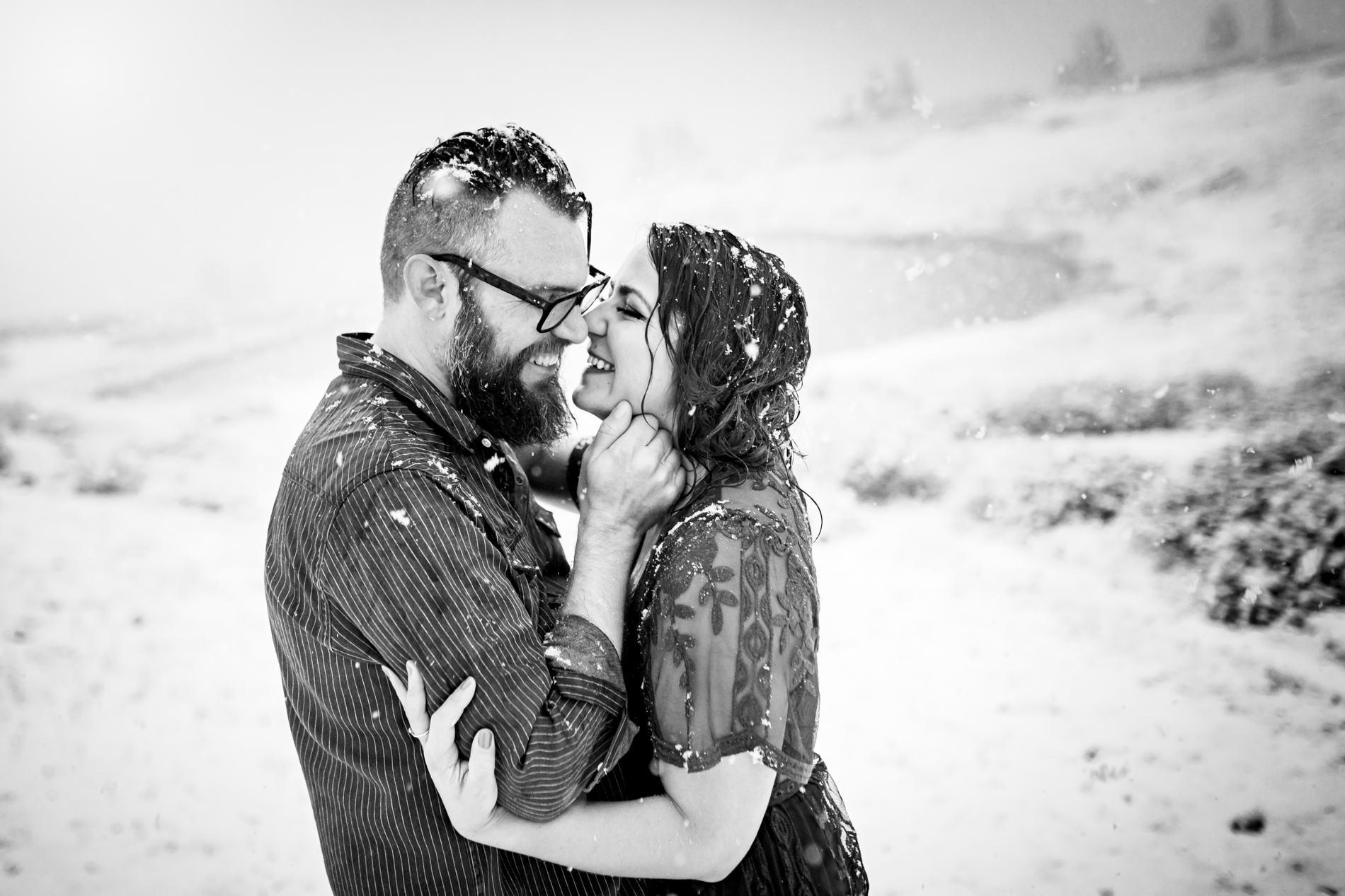 Cottonwood Pass Engagement Photos in Buena Vista with fall foliage, mountains and a winter blizzard