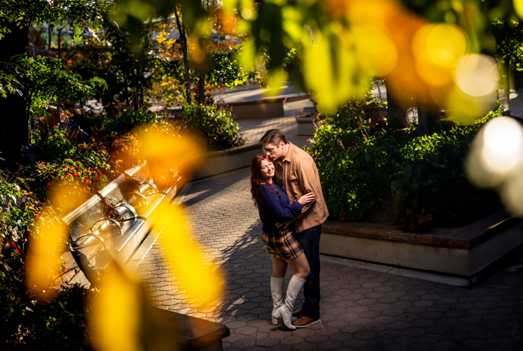 Jessa and Reid's Fort Collins engagement photos downtown in Old Town Square in the fall.