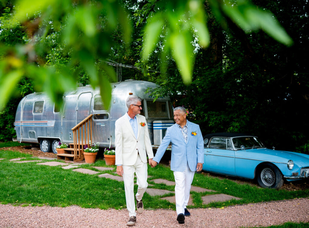 Two grooms celebrate their wedding with their closest family and friends at The Lyons Farmette in Lyons, CO