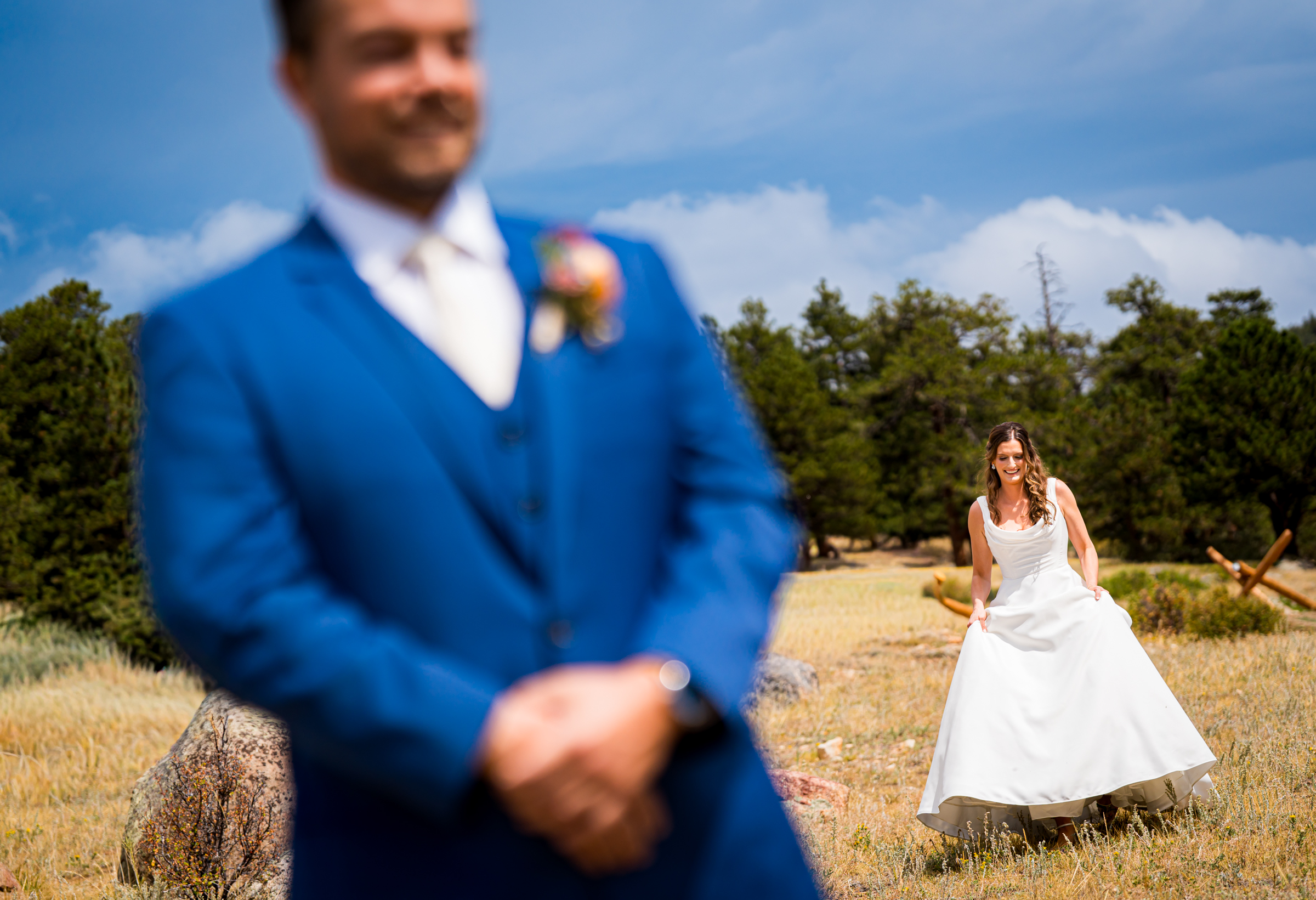 Bride walks up to groom during first look at Rocky Mountain National Park