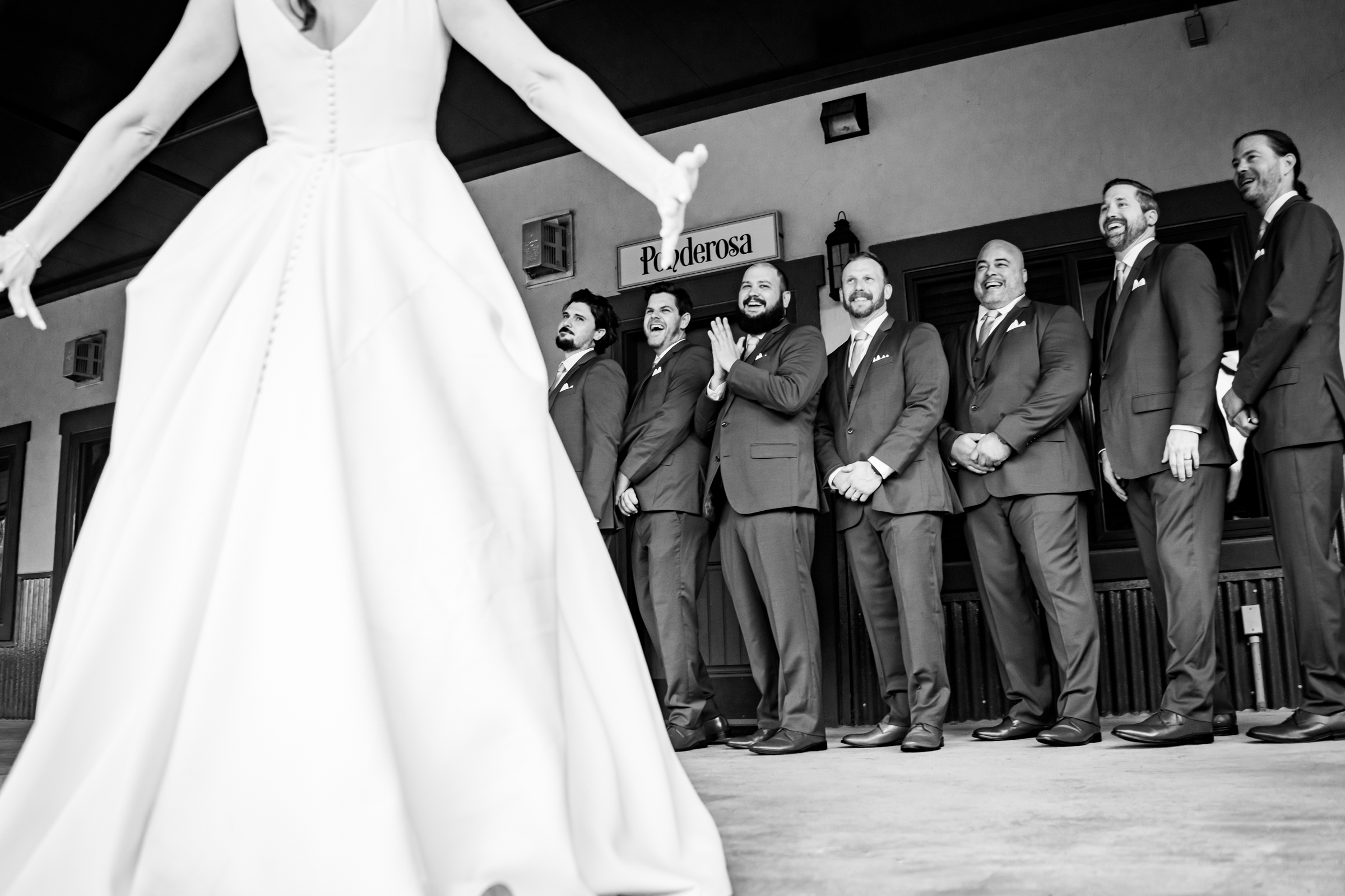 Bride has a first look with the groomsmen before the wedding ceremony