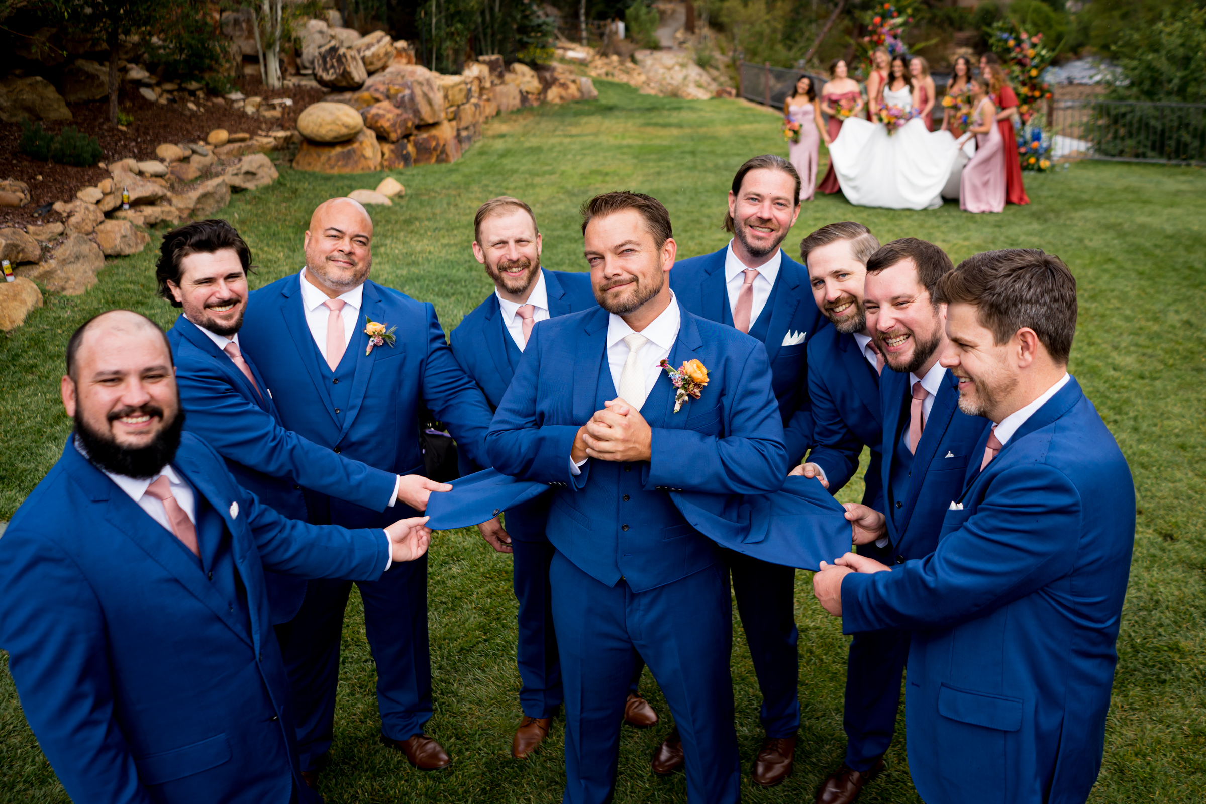 Groom and groomsmen mimic the bridal party photos