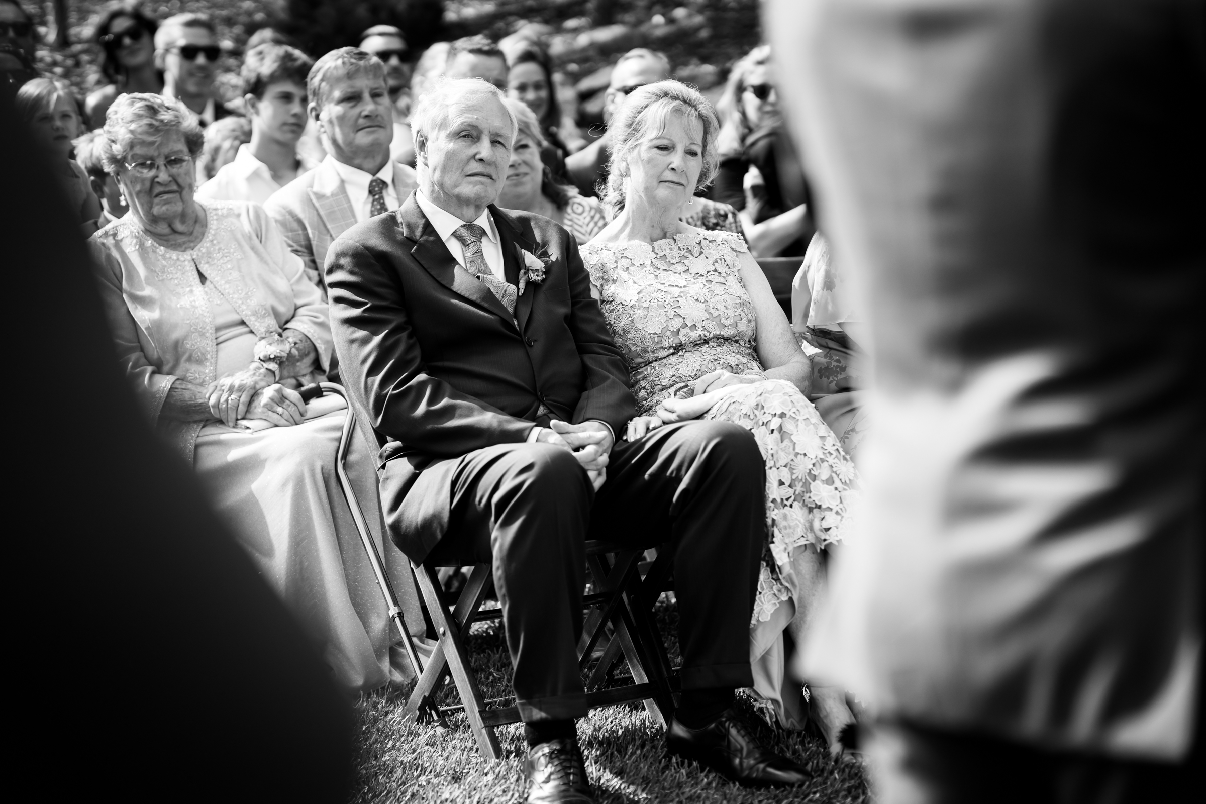 Parents of the bride watch the wedding ceremony