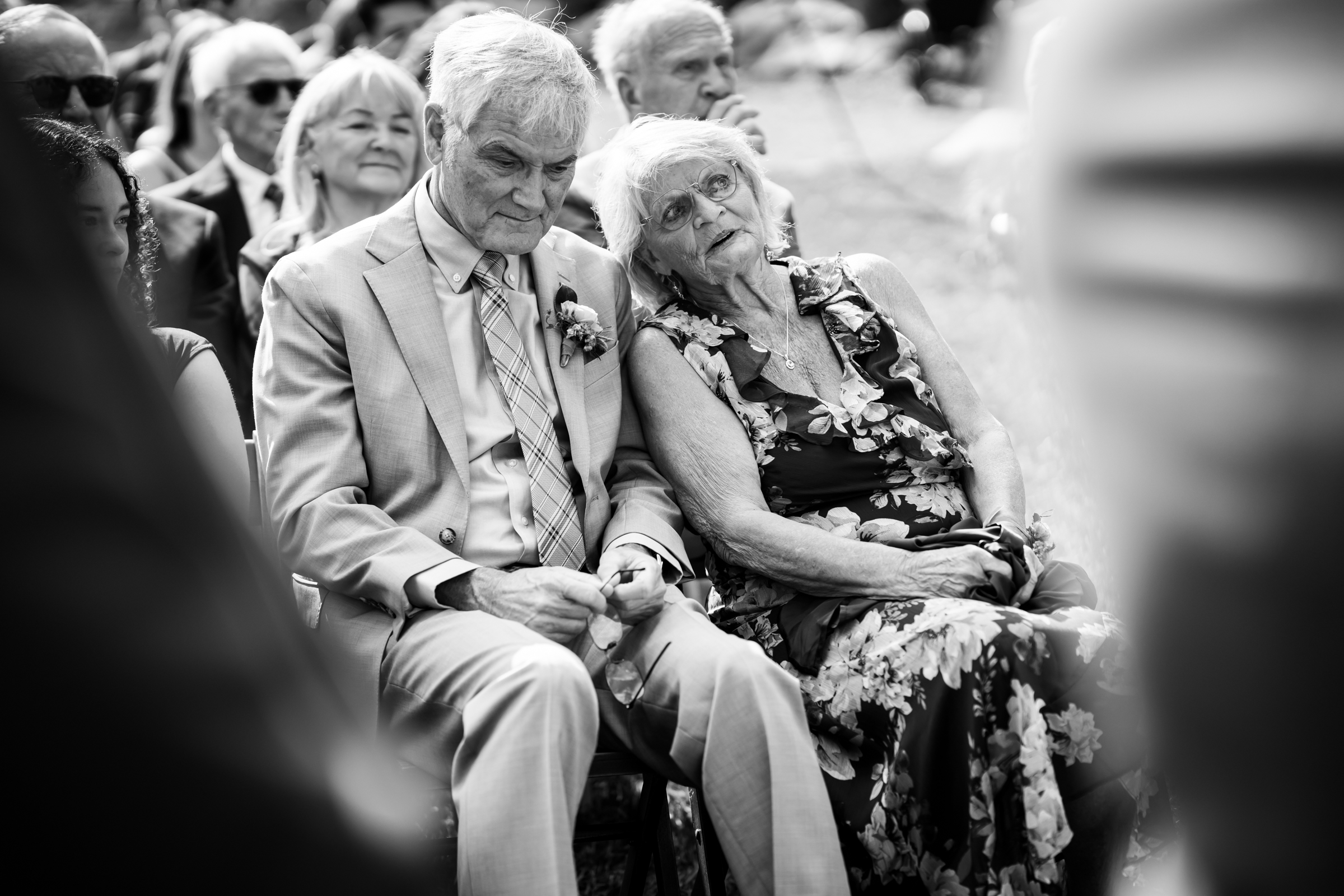 Parents of the groom watch the wedding ceremony